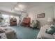 Open living space with plush seating, a ceiling fan, and natural light at 7902 Heather Ct, Tampa, FL 33634