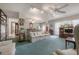 A comfortable living room with a ceiling fan, and a view into the dining area at 7902 Heather Ct, Tampa, FL 33634
