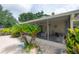 View of screened in porch with seating at 7902 Heather Ct, Tampa, FL 33634