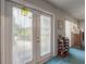 Bright sunroom with access to the backyard, a wine rack, and natural light at 7902 Heather Ct, Tampa, FL 33634