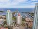 An aerial view showcases luxury condos with marina, pool, and ocean views, highlighting a prime location for upscale living at 100 Beach Ne Dr # 301, St Petersburg, FL 33701
