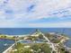 An aerial photograph showcases a pier, waterfront park, and recreational areas along the coastline at 100 Beach Ne Dr # 301, St Petersburg, FL 33701