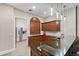 A well-appointed bar area includes sleek countertops, dark wood cabinetry, and modern pendant lighting at 100 Beach Ne Dr # 301, St Petersburg, FL 33701