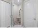 Bathroom features a stone tiled shower and a glass shower door at 100 Beach Ne Dr # 301, St Petersburg, FL 33701