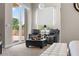 Cozy bedroom featuring access to outdoor living space and comfortable seating at 100 Beach Ne Dr # 301, St Petersburg, FL 33701