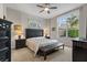 Serene bedroom with a large window and dark wood furniture at 100 Beach Ne Dr # 301, St Petersburg, FL 33701