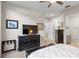 Bedroom with a large TV, neutral walls, and a connecting bath at 100 Beach Ne Dr # 301, St Petersburg, FL 33701