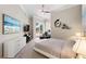 Well-lit bedroom offers modern furniture and access to an outdoor patio space at 100 Beach Ne Dr # 301, St Petersburg, FL 33701