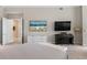 Relaxing bedroom with a neutral color palette, accent painting, and entertainment area at 100 Beach Ne Dr # 301, St Petersburg, FL 33701