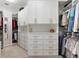 Spacious walk-in closet with ample shelving, cabinets, and hanging storage at 100 Beach Ne Dr # 301, St Petersburg, FL 33701