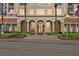 Building facade with a classic design, featuring decorative columns, manicured greenery, and prominent signage at 100 Beach Ne Dr # 301, St Petersburg, FL 33701