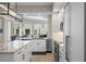 Modern kitchen boasts granite counters, island with bar stools, and open layout to living area at 100 Beach Ne Dr # 301, St Petersburg, FL 33701