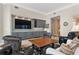 Bright living room features built-in cabinets, a television, and comfortable seating at 100 Beach Ne Dr # 301, St Petersburg, FL 33701