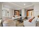 Spacious living area featuring multiple seating options, a large glass coffee table, and ample natural light at 100 Beach Ne Dr # 301, St Petersburg, FL 33701