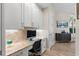 Bright office area with custom cabinetry, granite counters, and cozy workspace at 100 Beach Ne Dr # 301, St Petersburg, FL 33701