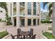 Stylish outdoor patio features brick flooring, lounge seating and well-maintained landscaping offering a relaxing ambiance at 100 Beach Ne Dr # 301, St Petersburg, FL 33701