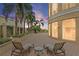Serene patio with lounge chairs, lush landscaping, and views for relaxing and outdoor enjoyment at 100 Beach Ne Dr # 301, St Petersburg, FL 33701