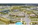 An aerial view showcasing the beautiful community amenities including ponds, tennis courts, and a luxurious clubhouse at 10244 Shadow Branch Dr, Tampa, FL 33647