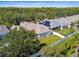An aerial view of a home and fenced backyard with a well-manicured lawn at 10244 Shadow Branch Dr, Tampa, FL 33647