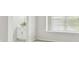 Bright bathroom with modern vanity and finishes; large window provides natural light at 10244 Shadow Branch Dr, Tampa, FL 33647