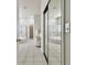 Bright bathroom featuring dual vanities, soaking tub, and glass enclosed shower at 10244 Shadow Branch Dr, Tampa, FL 33647