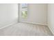 Light and airy bedroom with soft carpeting and a bright window with natural light at 10244 Shadow Branch Dr, Tampa, FL 33647
