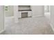 A carpeted flex space with a built in desk area and ample room for activities at 10244 Shadow Branch Dr, Tampa, FL 33647