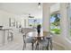 Breakfast nook with a wooden table and chairs, complemented by natural light and an open layout to the living space at 10244 Shadow Branch Dr, Tampa, FL 33647