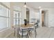 Breakfast nook features a wooden table with seating near a window, plus a convenient built in workspace at 10244 Shadow Branch Dr, Tampa, FL 33647