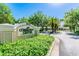 A welcoming community center sign with lush landscaping creates a warm and inviting entrance at 10244 Shadow Branch Dr, Tampa, FL 33647