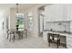 Dining area near a built-in desk area with a view to the back yard at 10244 Shadow Branch Dr, Tampa, FL 33647