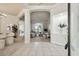 Elegant foyer features neutral tile floors, arched doorways, and a view into the living room at 10244 Shadow Branch Dr, Tampa, FL 33647