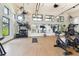 Bright gym features exercise bikes, mirrors, weights and large windows providing ample natural light at 10244 Shadow Branch Dr, Tampa, FL 33647