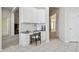 Dedicated home office area with built-in desk, white cabinets, and stylish decor at 10244 Shadow Branch Dr, Tampa, FL 33647
