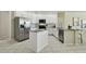 Bright kitchen with white cabinets, stainless steel appliances, and granite countertops at 10244 Shadow Branch Dr, Tampa, FL 33647