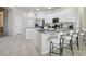 Spacious kitchen with a breakfast bar, granite countertops, and bright, neutral decor at 10244 Shadow Branch Dr, Tampa, FL 33647