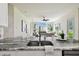 Kitchen sink and countertop detail open to the living room at 10244 Shadow Branch Dr, Tampa, FL 33647