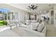Spacious living room with tile floors, comfortable sofas, and plenty of natural light at 10244 Shadow Branch Dr, Tampa, FL 33647