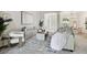 Bright, airy living room with stylish seating, decor, and large windows, perfect for relaxing or entertaining at 10244 Shadow Branch Dr, Tampa, FL 33647
