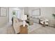 Cozy living room with contemporary furnishings, bright light, and neutral color palette at 10244 Shadow Branch Dr, Tampa, FL 33647