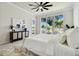 Light-filled main bedroom with large window, backyard view, and sophisticated decor at 10244 Shadow Branch Dr, Tampa, FL 33647
