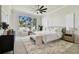 Inviting main bedroom with large windows, plush rug, and stylish furniture at 10244 Shadow Branch Dr, Tampa, FL 33647