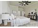 Light and airy main bedroom with ceiling fan and ensuite access at 10244 Shadow Branch Dr, Tampa, FL 33647