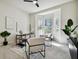 Bright office space with large bay windows, neutral paint, and stylish decor at 10244 Shadow Branch Dr, Tampa, FL 33647