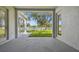 Covered patio overlooking a green lawn and tall trees at 10244 Shadow Branch Dr, Tampa, FL 33647