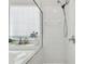 Close up of bright bathroom with soaking tub, glass shower, and tile surround at 10244 Shadow Branch Dr, Tampa, FL 33647