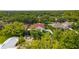 Aerial view of a home featuring lush landscaping in a suburban neighborhood at 10310 Carroll Cove Pl, Tampa, FL 33612