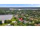 Aerial shot of a suburban house near a lake, showcasing its desirable location at 10310 Carroll Cove Pl, Tampa, FL 33612