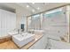 Bathroom with double sinks and granite countertops, plus glass shower at 10310 Carroll Cove Pl, Tampa, FL 33612
