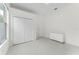 Bedroom featuring marble floors, bi-fold closet, and neutral color palette at 10310 Carroll Cove Pl, Tampa, FL 33612